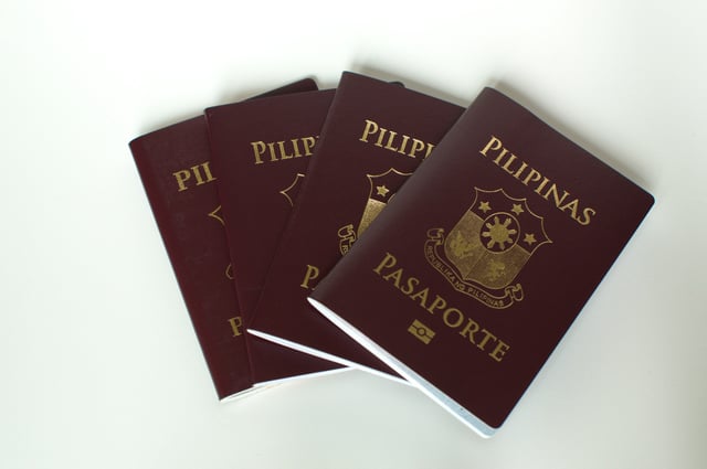 A Bunch Of Newly Issued Philippine Passport Against White Background