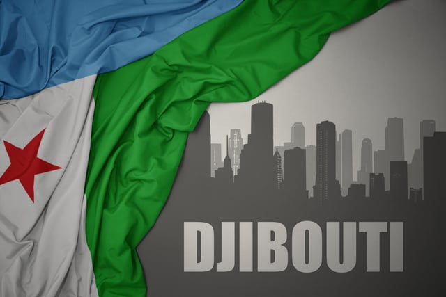 Abstract Silhouette Of The City With Text Djibouti Near Waving Colorful National Flag