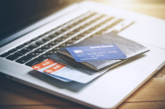 Air Tickets Passports And Credit Card Near Laptop
