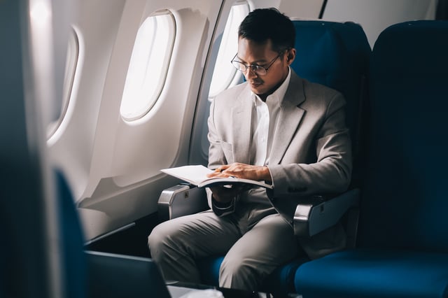 Airplane Travel And Portrait Of Businessman Working On Laptop Computer