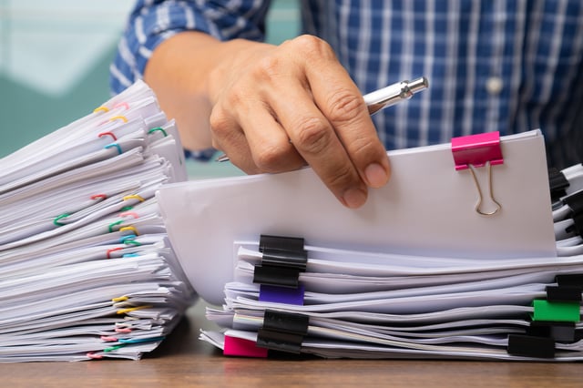 Business Man Hand Pick Up Stack Overload Document Report Paper