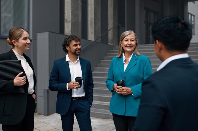 Business Professionals Meeting Outside Office Building