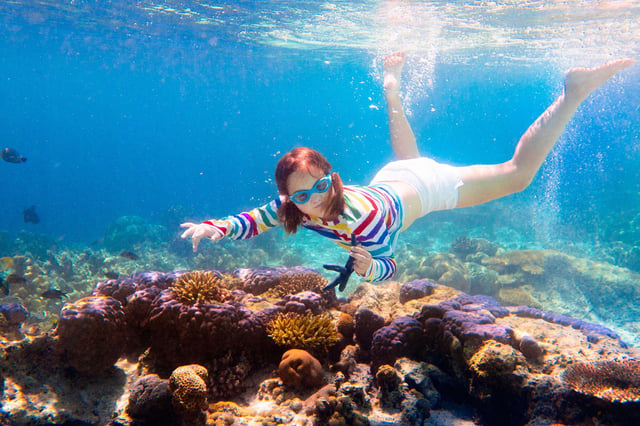 Child snorkelling underwater
