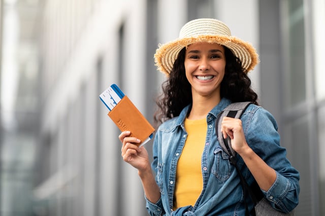 Closeup Of Cheerful Pretty Woman Holding Passport