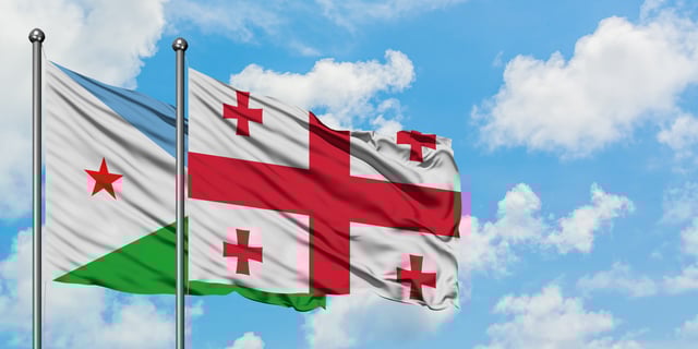 Djibouti And Georgia Flag Waving In The Wind Against White