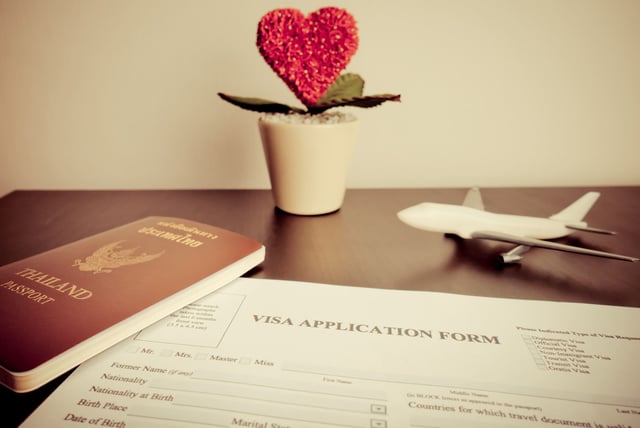 Documents For Visa For Homneymoon Trip On Desk