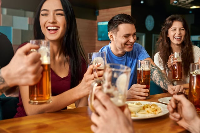 Friends having beer in a beer bar