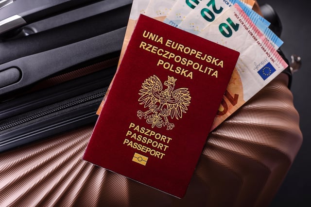 International Passport Of A Citizen Of Poland On A Suitcase