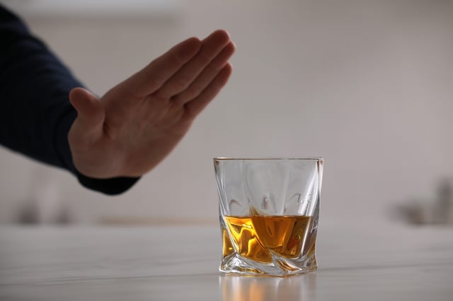 Man saying no to alcohol Man saying no to alcohol