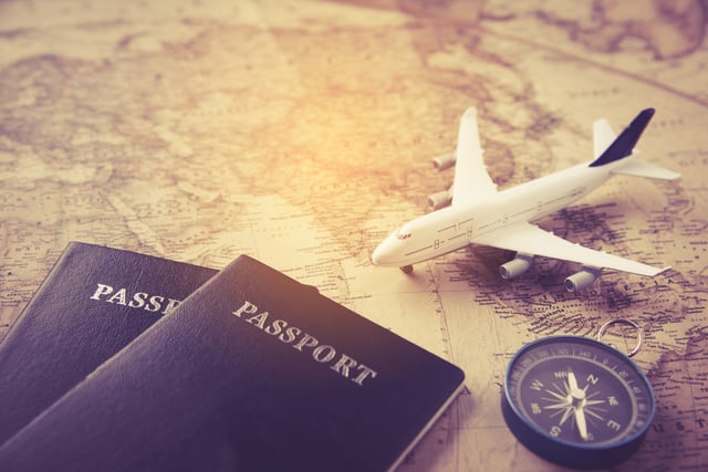 Passport Plane Compass Placed On Map