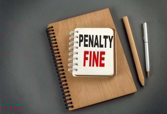 Penalty Fine Text On A Notebook With Pen And Pencil