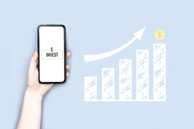 Phone with invest sign, financial chart