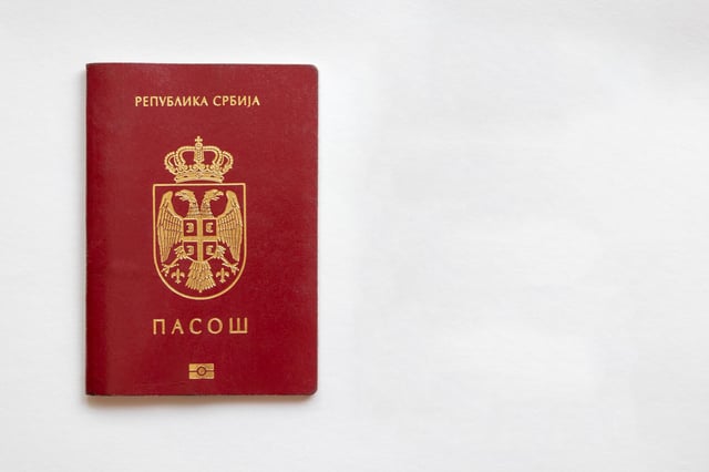 Serbian Passport Isolated On Left Side On White Paper Background