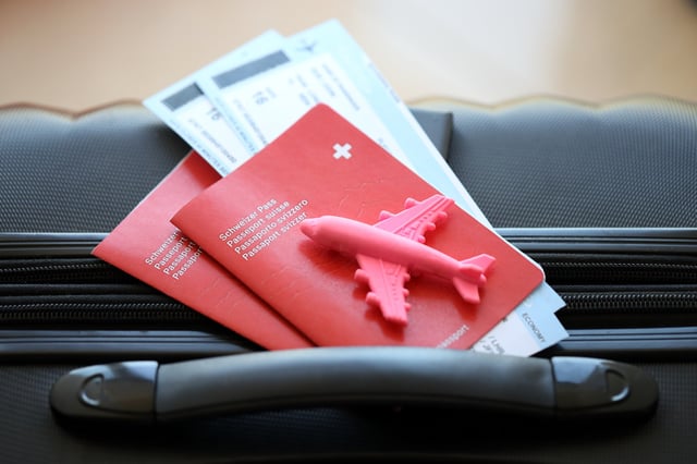 Swiss Passport And Avia Tickets On Travel Bag