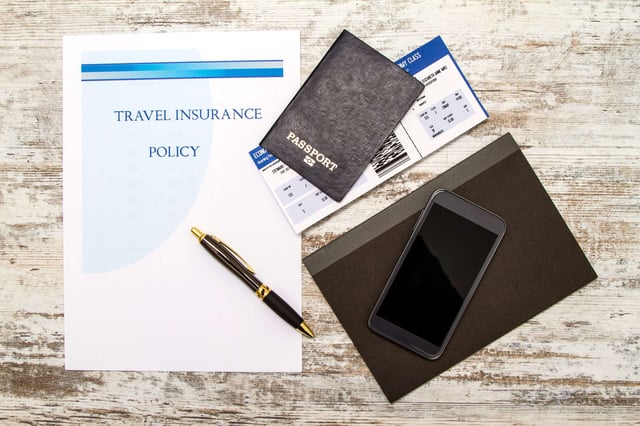 Travel Insurance Policy Booklet With A Boarding Pass And A Passport