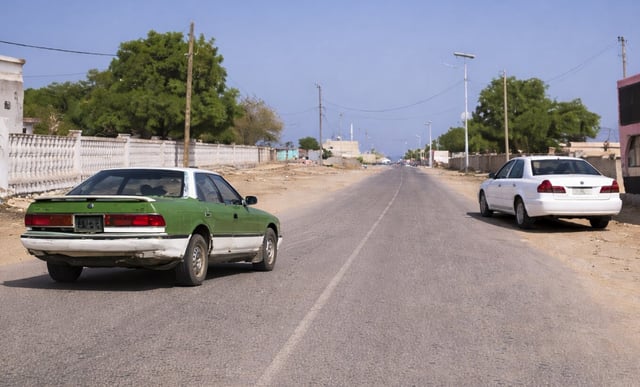 Two cars on Obock Road, Djibouti