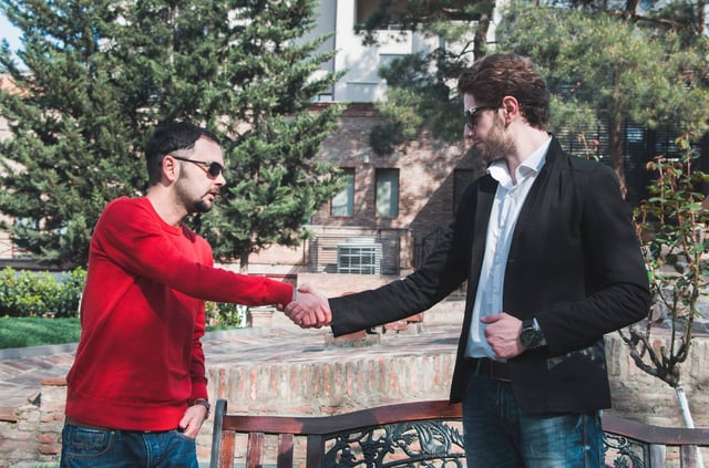 Two people doing a handshake