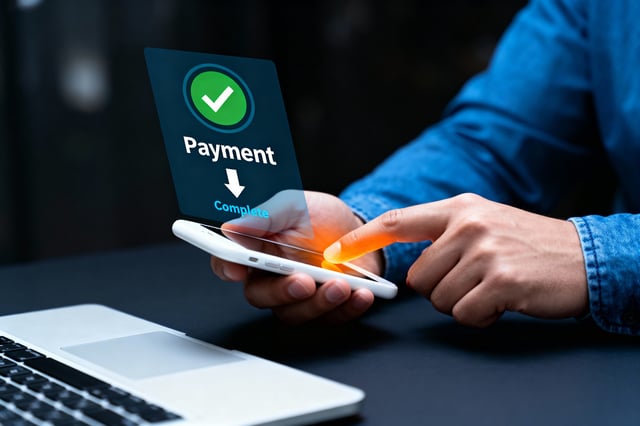 User Completing An Online Payment On Smartphone