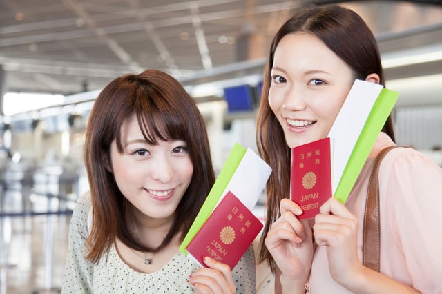 Women Who Smile With A Passport And Ticket