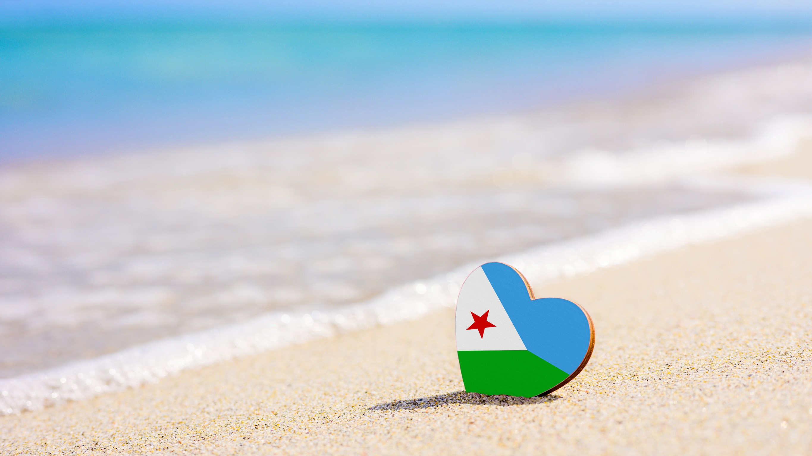 Flag Of Djibouti In The Shape Of A Heart On A Sandy Beach