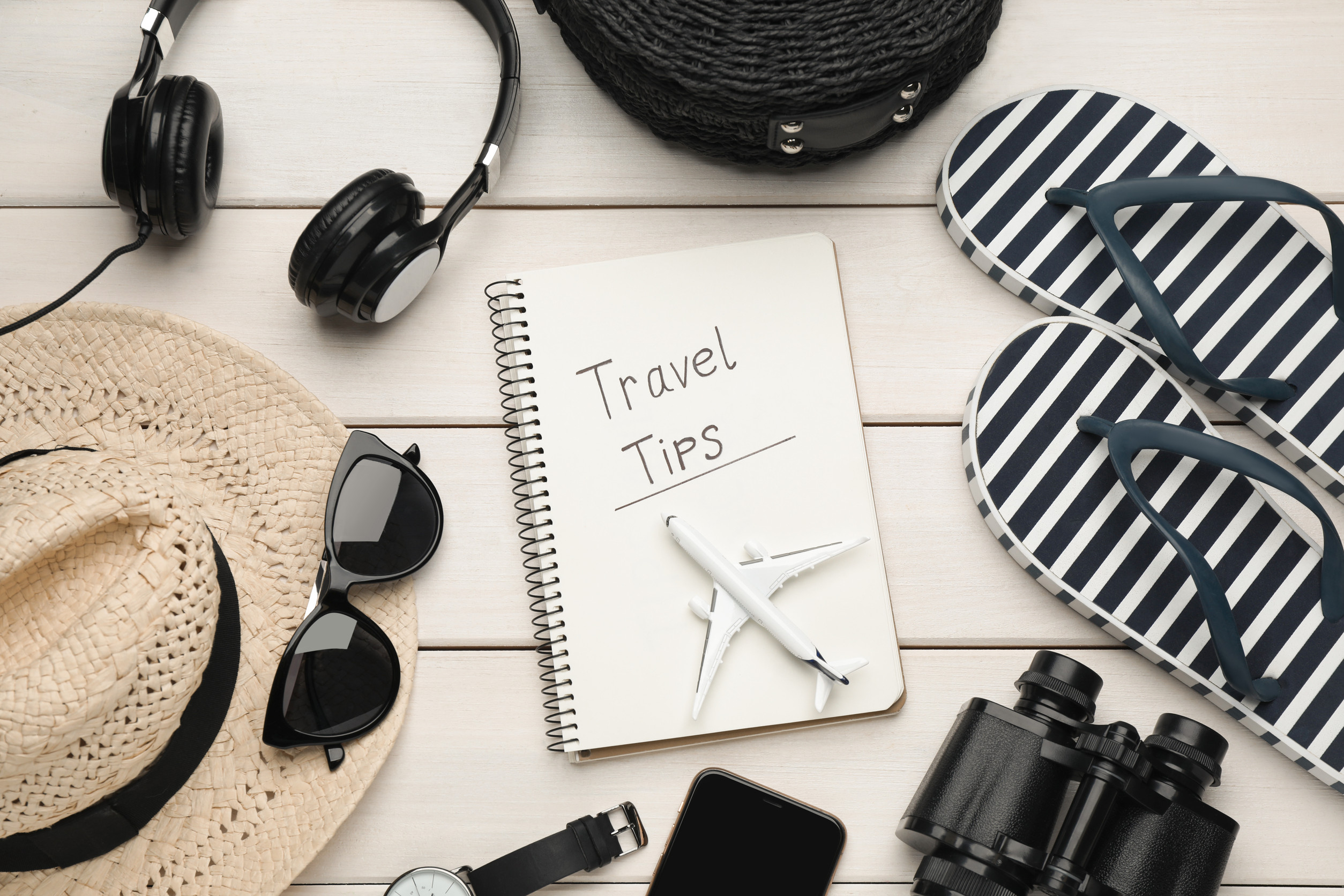 Flat Lay Composition With Notebook On White Wooden Table Travel Tips