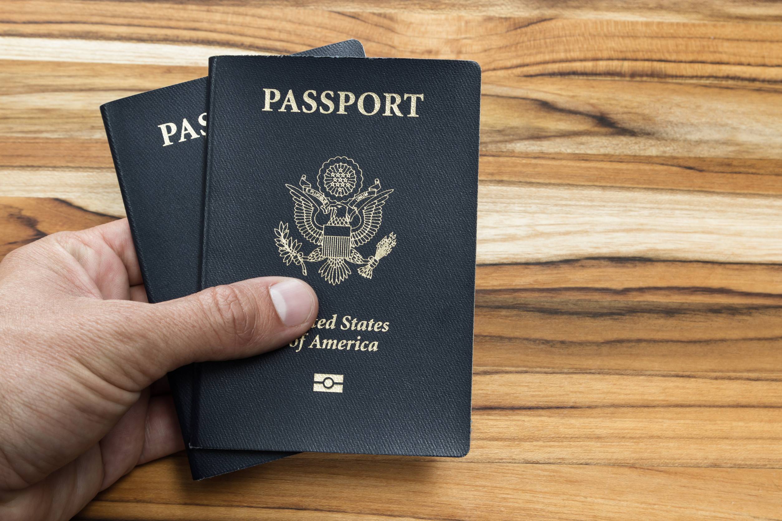 Holding Tow American Passports