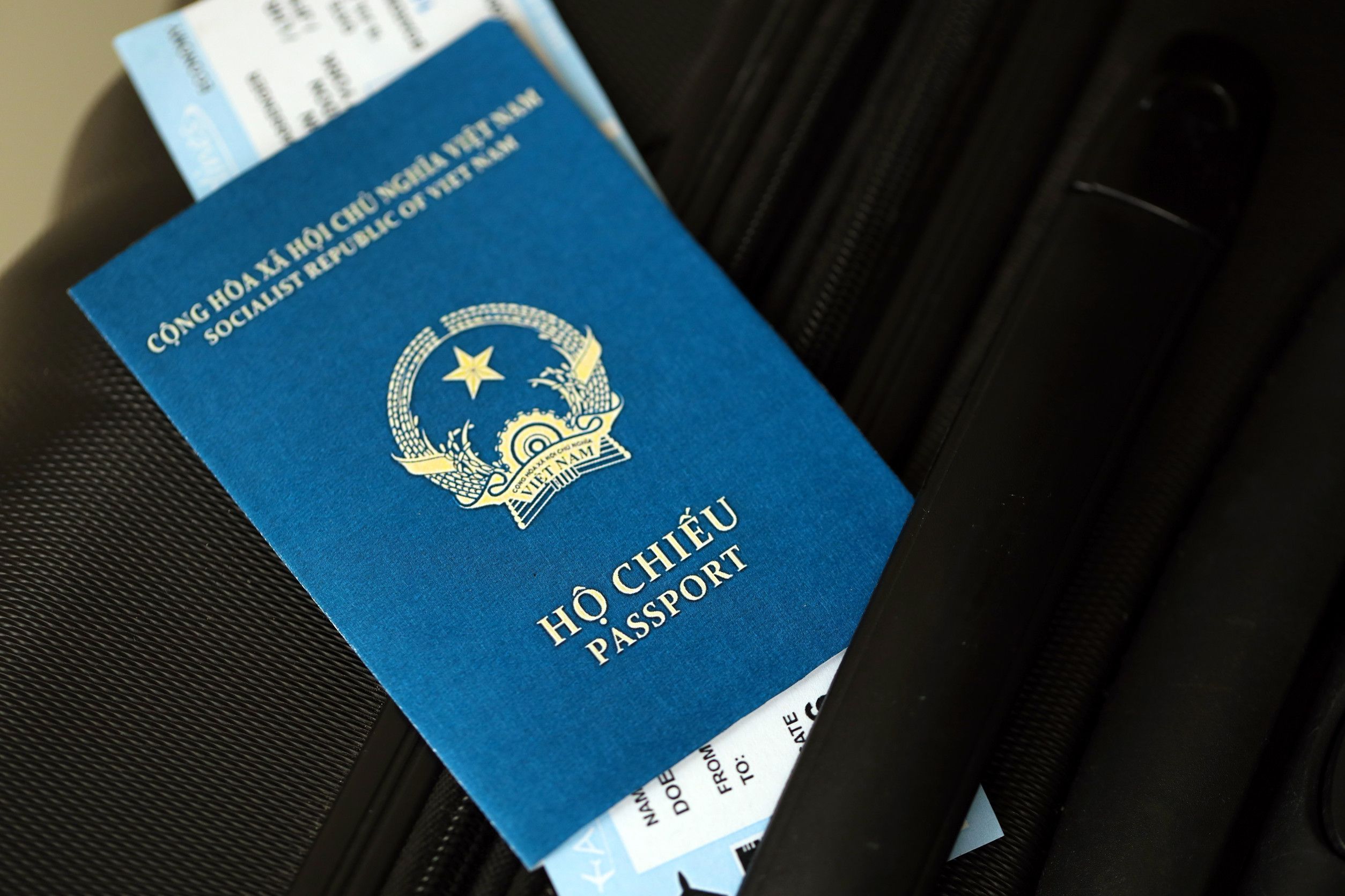 Vietnamese Passport And Avia Tickets On Travel Bag